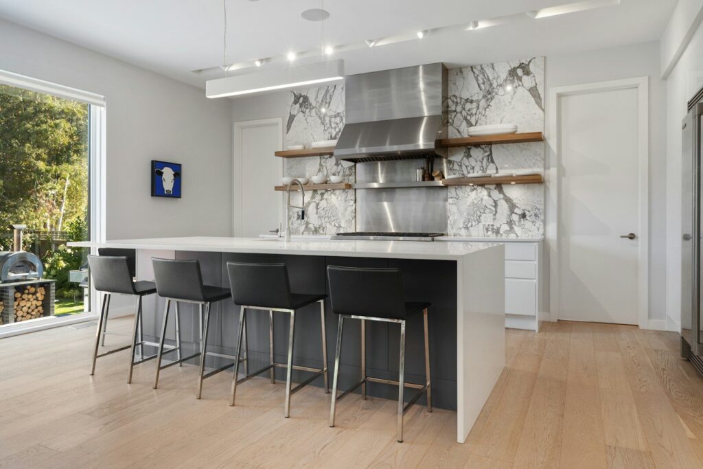 a kitchen with a bar and stools